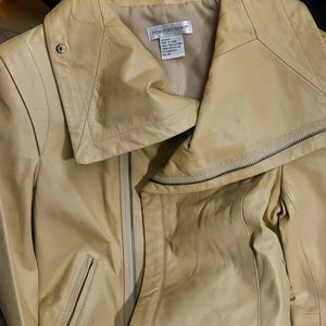 Classic and sexy Newport News cream colored, waist length, butter soft leather